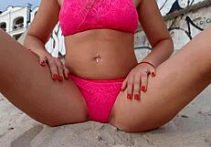 Crowded beach watches my daring public play